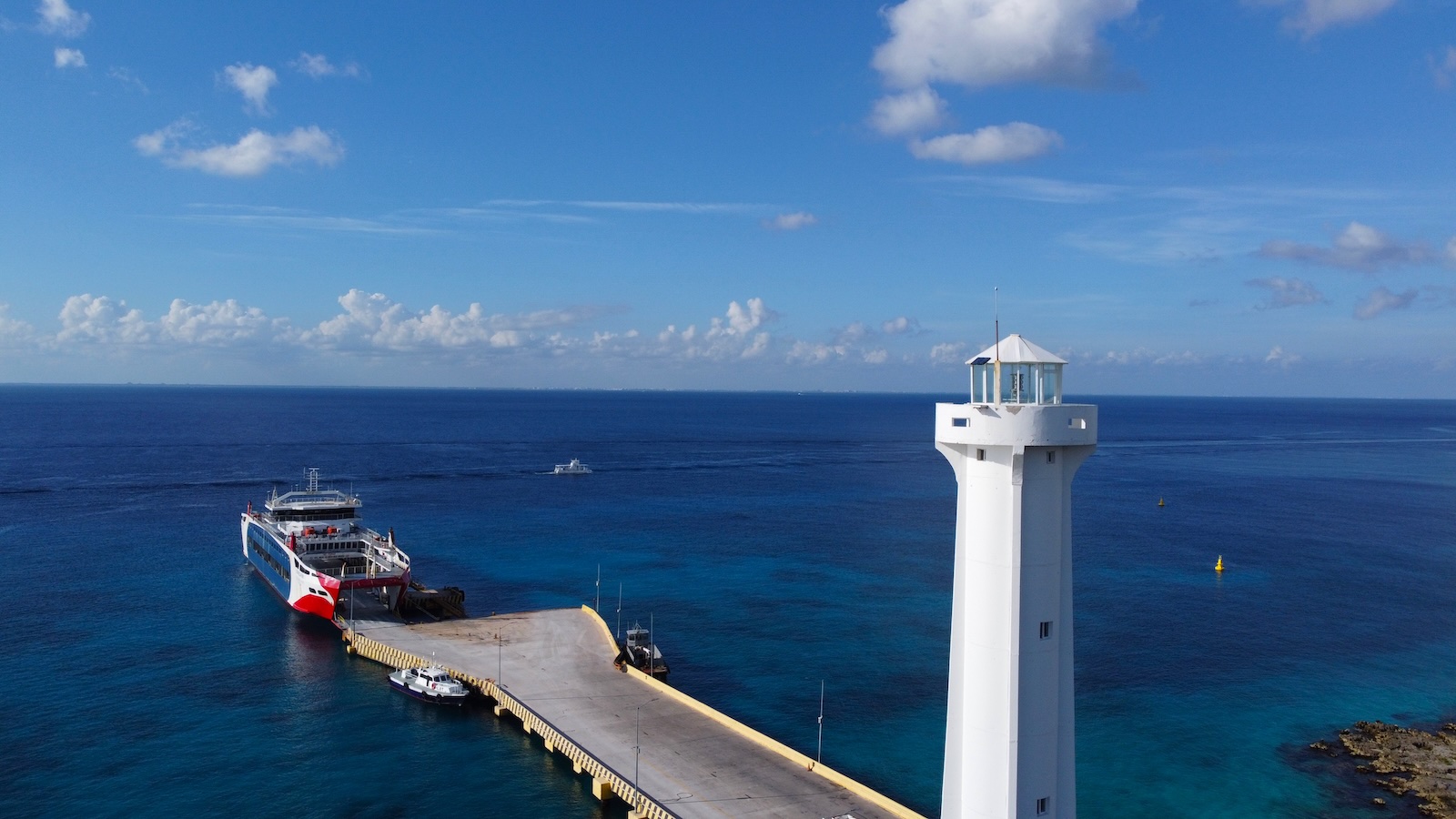 Cozumel lighthouse and ferry pier on the Caribbean