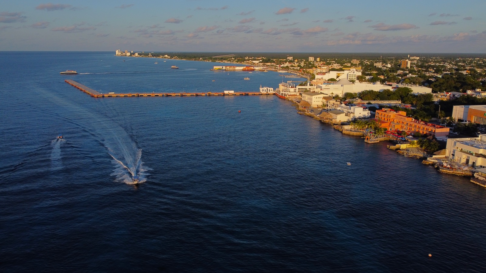 Golden sunset over Cozumel's waterfront at dusk